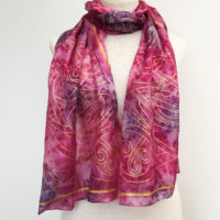 Silk-scarf-with-gold-Celtic-print-in-red-tones