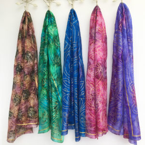 Range-of-silk-scarves-with-gold-Celtic-print