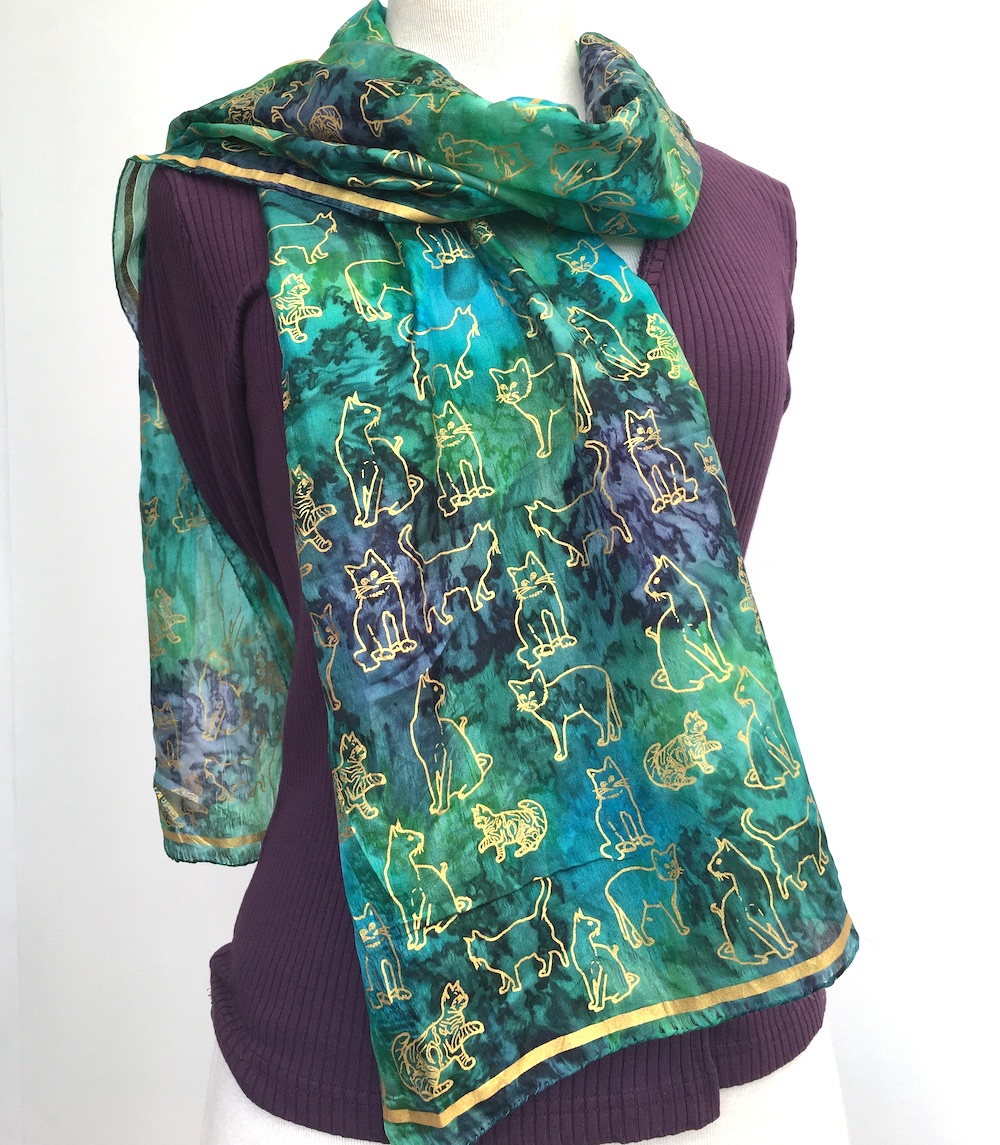 Long-silk-scarf-with-gold-cat-print-on-green